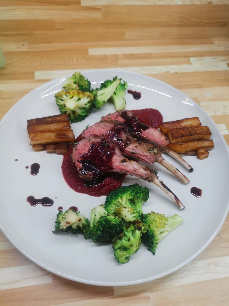 Elegant Lamb Chop Dinner Platter with Roasted Veggies & Broccoli Wallpaper