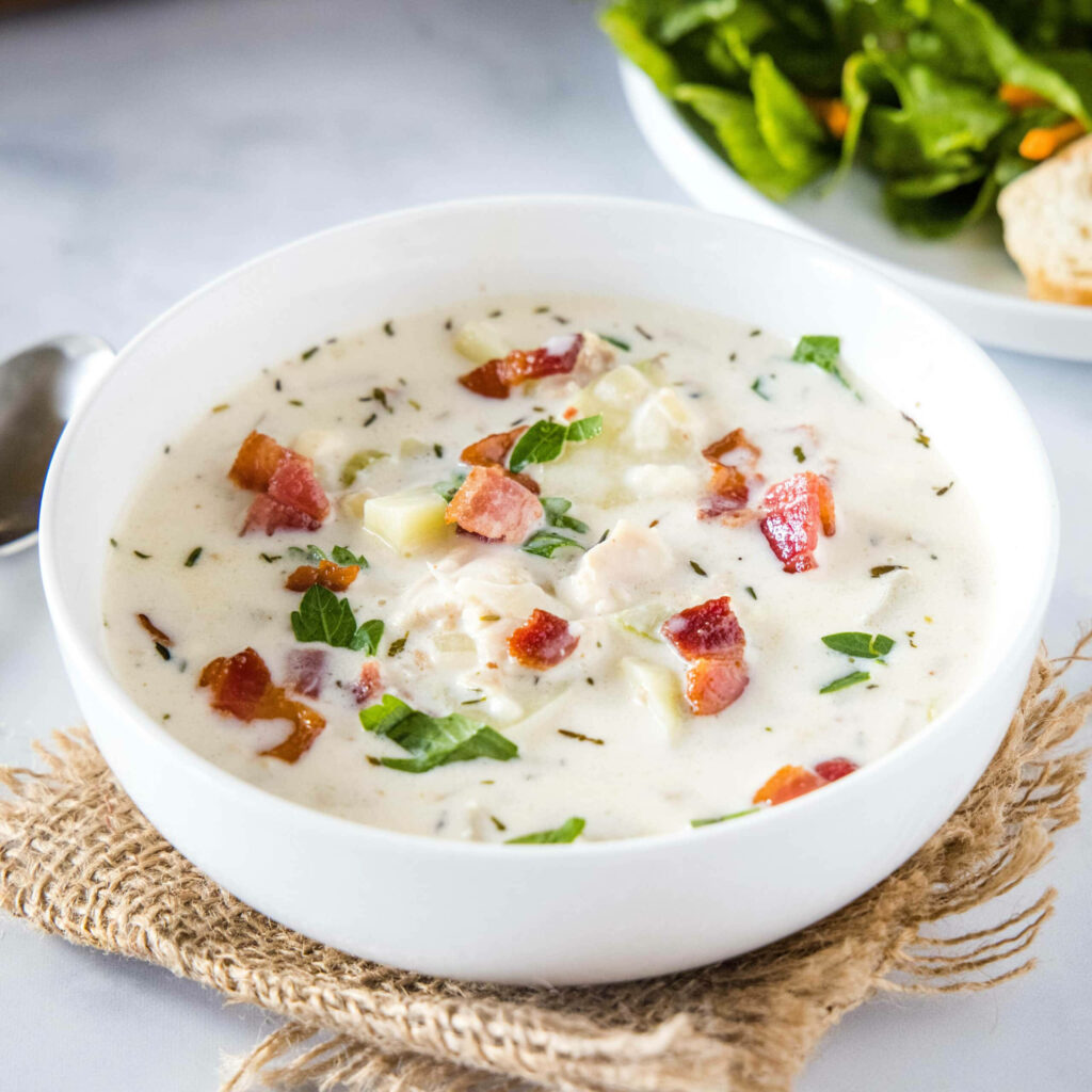 Delicious New England Clam Chowder Wallpaper with Creamy Herbs & Bacon