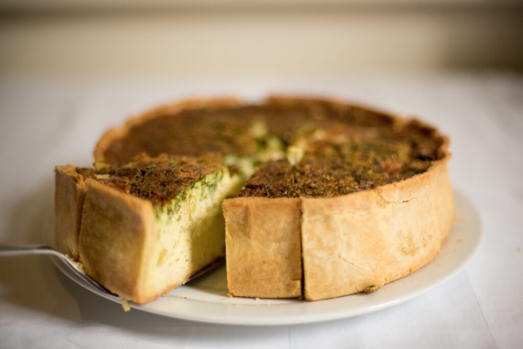 Golden Flaky Pastry with Savory Filling - Appetizing Wallpaper Background