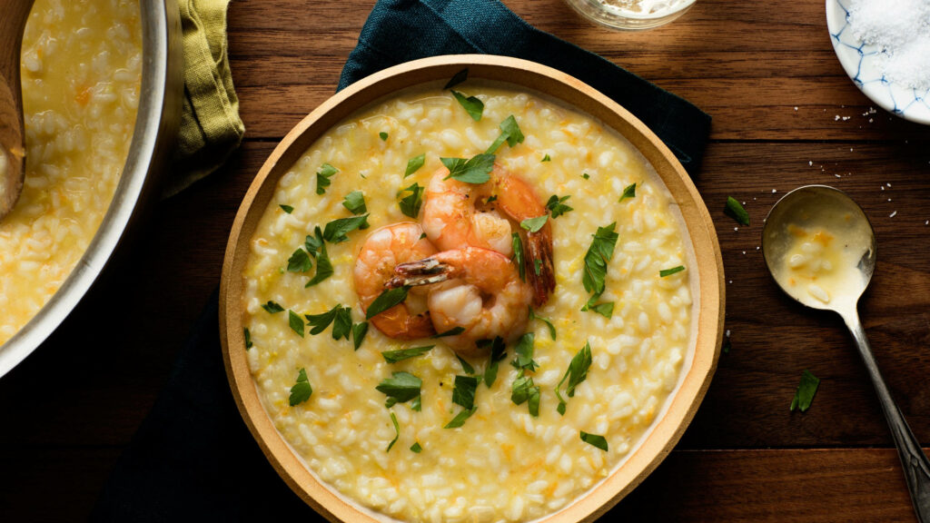 Delectable Creamy Risotto with Prawns - Warm Culinary Wallpaper