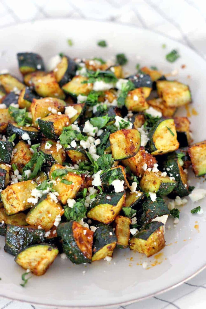 Close-Up Wallpaper of Seasoned Sautéed Zucchini with Cheese & Herbs