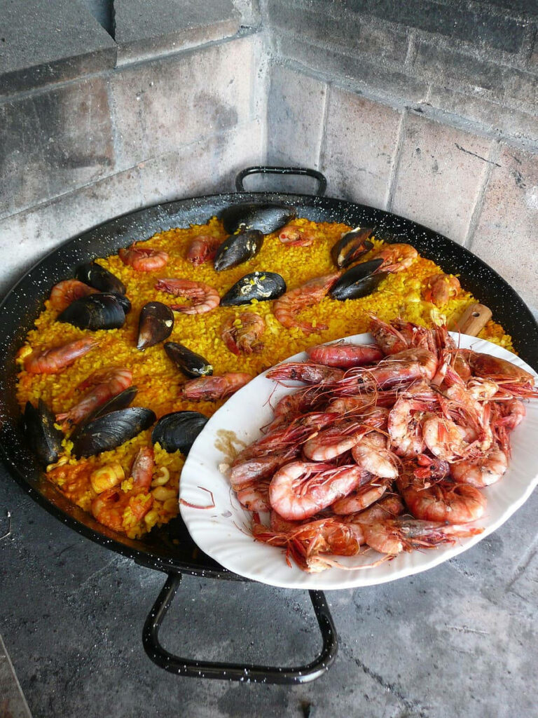 Indulge in Spanish Seafood: Mussel Paella & Prawns Wallpaper