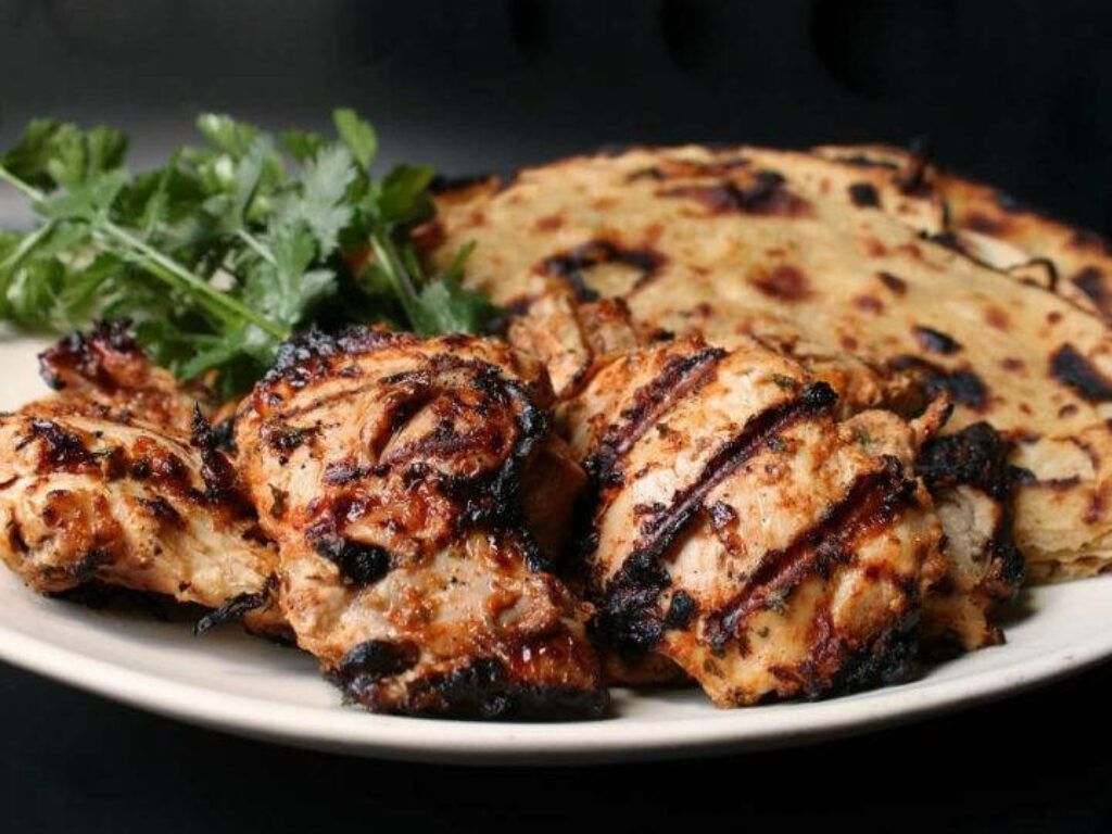 Delicious Tandoori Chicken Wallpaper with Flatbreads & Fresh Coriander