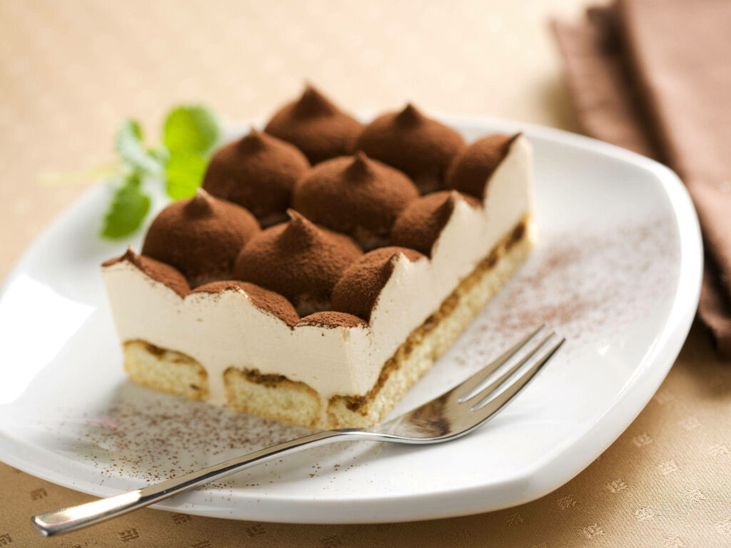 Decadent Tiramisu Delight – Captivating Ceramic Platter Unveiling a Scrumptious Treat Wallpaper