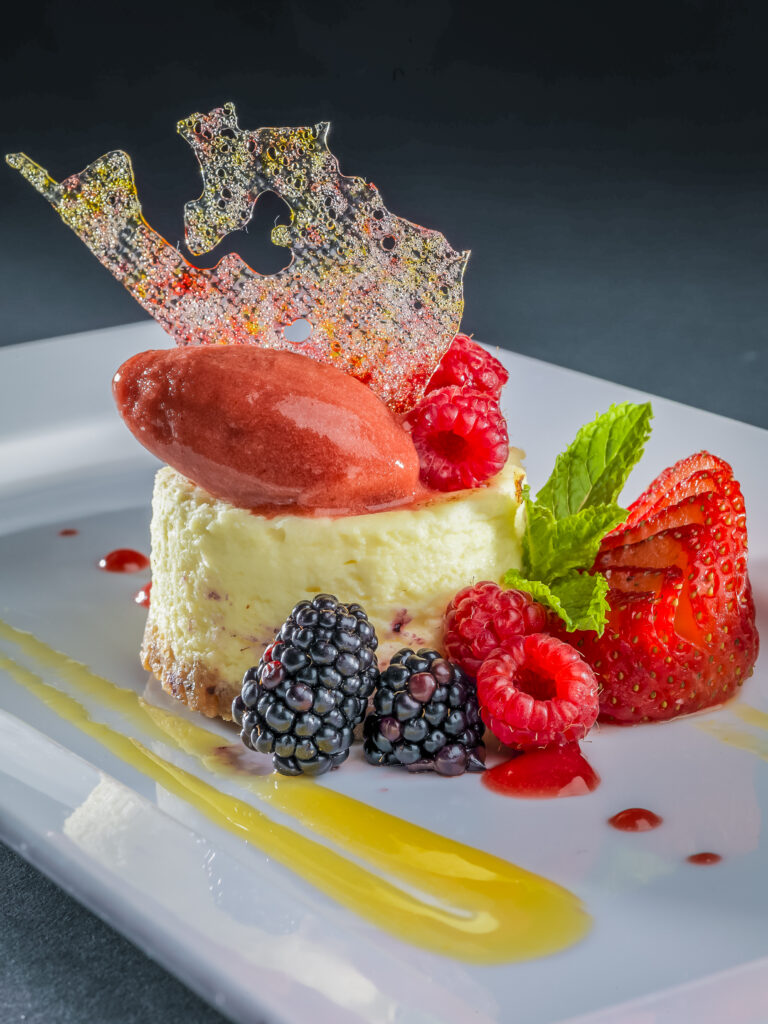 Delicious Cheesecake Wallpaper: Elegant Dessert with Fresh Berries