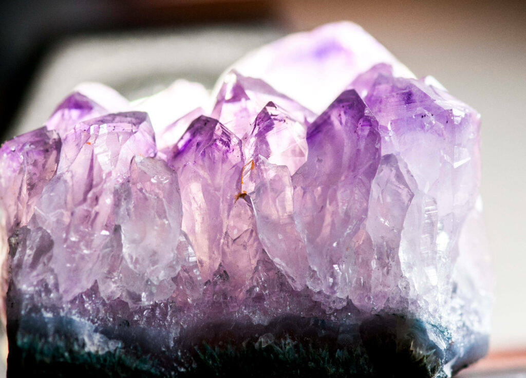 Close up of pale amethyst crystals with delicate purple hues natural translucent beauty wallpaper