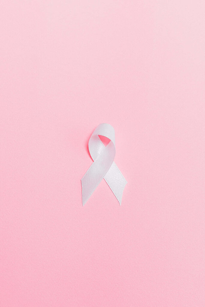 Delicate Pale Pink Background with White Ribbon Wallpaper Design