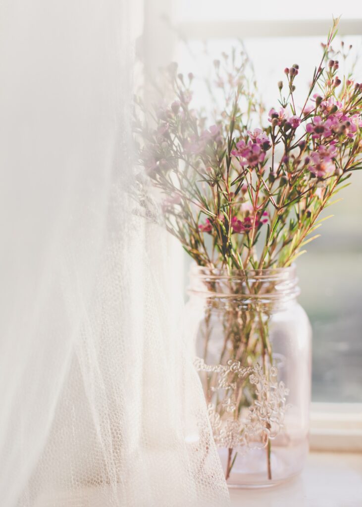 Delicate Pink Flower Bouquet in Clear Vase | Natural Light Background Wallpaper