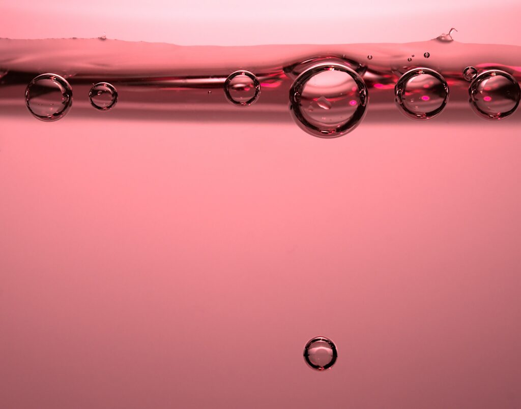 Delicate Pink Liquid Macro Wallpaper with Soothing Bubbles