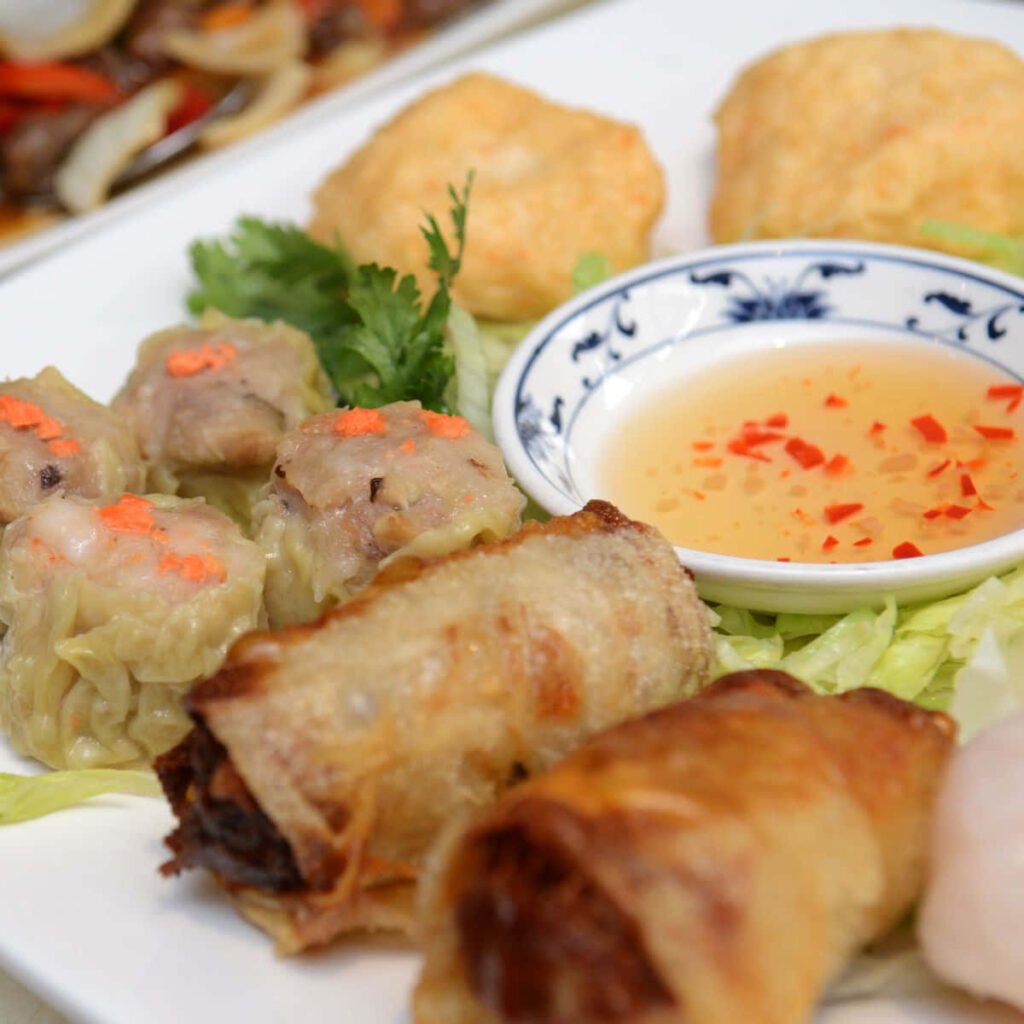 Delicious Asian Cuisine: Spring Rolls, Dumplings & Fresh Herbs Wallpaper