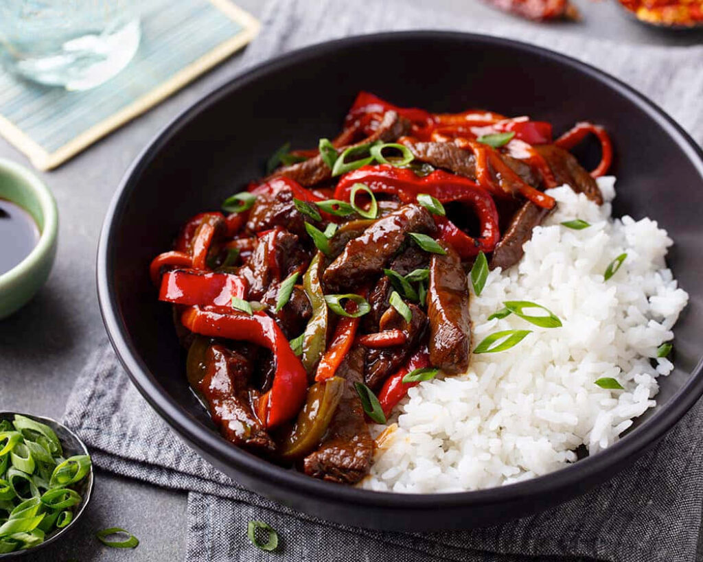 Delicious Beef Rice Bowl with Peppers - Wallpaper Background