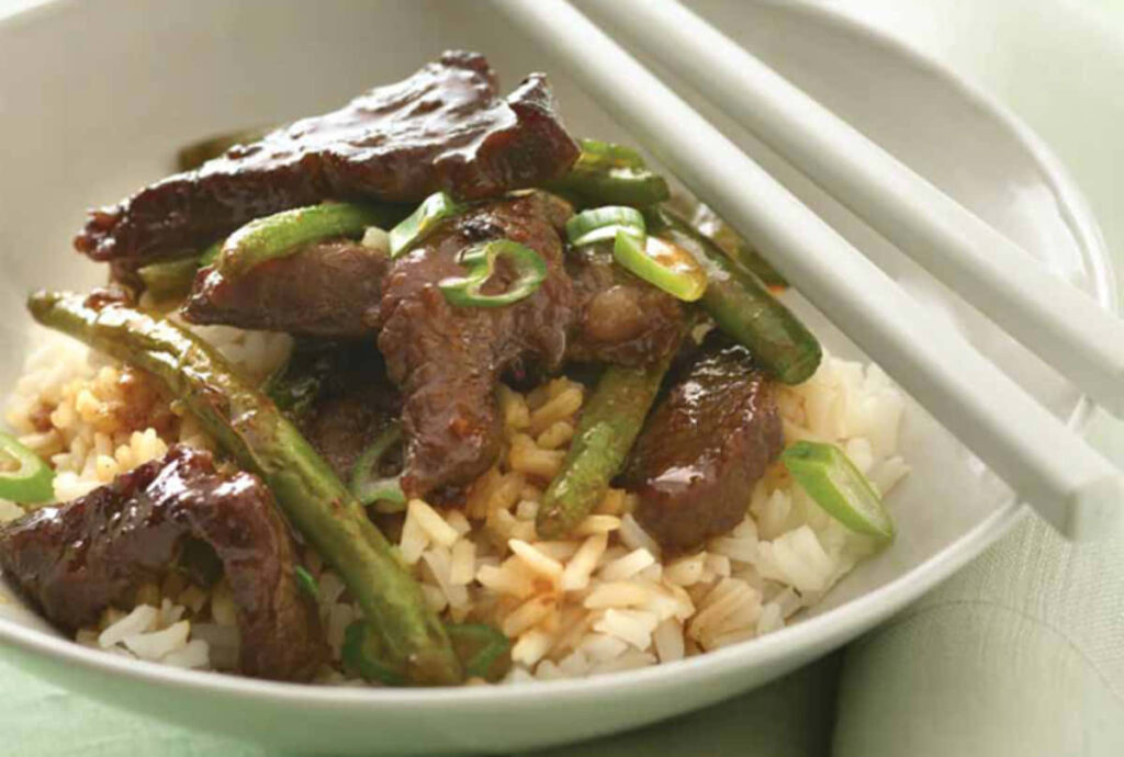 Delicious Beef Stir-Fry with Green Beans over Rice - Wallpaper Background