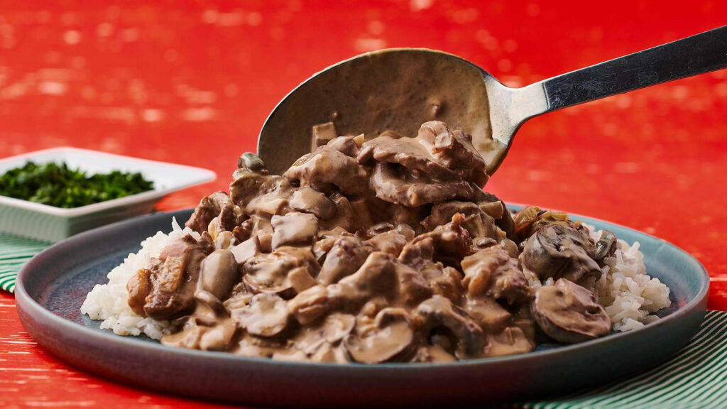 Elegant Beef Stroganoff Over Rice in Nordic Style - Wallpaper Background