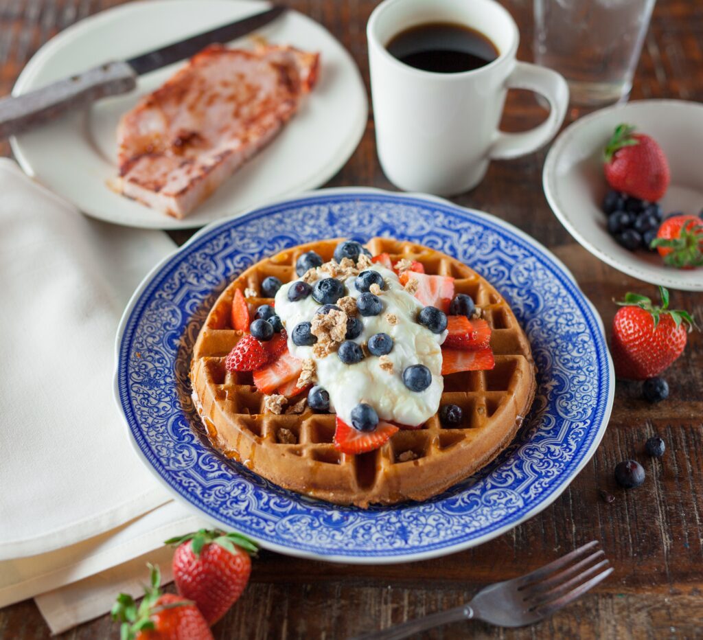 Delicious Belgian Waffle Wallpaper with Fresh Berries & Cream