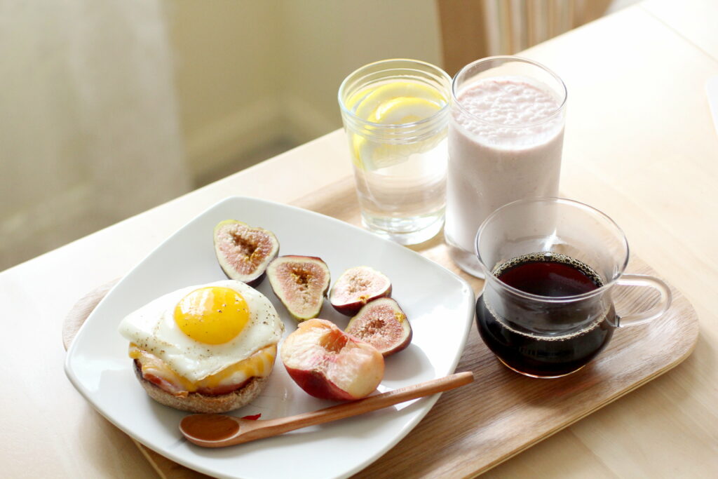 Delicious Breakfast Spread: Scrambled Eggs, Figs, Fruits & Coffee Wallpaper
