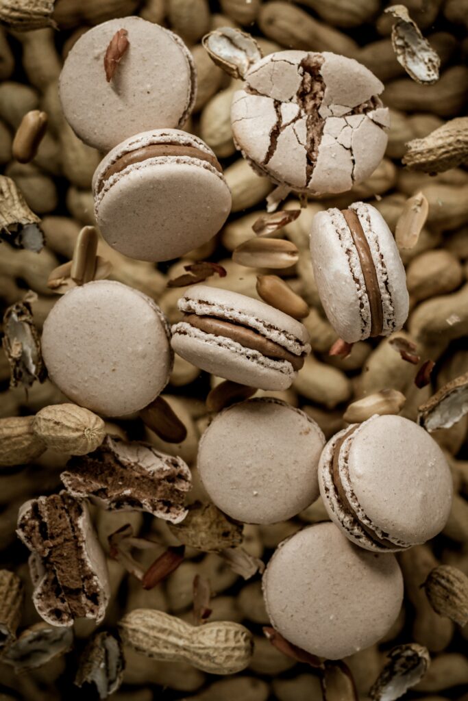 Elegant Macarons on Nuts - Tempting Dessert Wallpaper Background