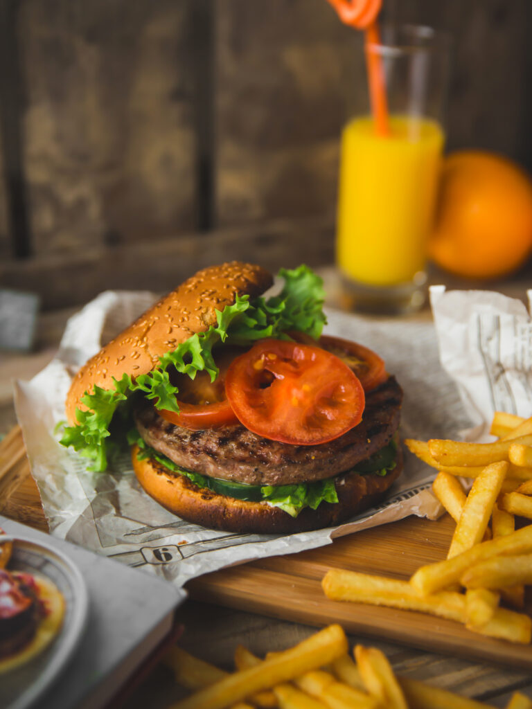 Delicious Burger with Juicy Cutlet, Fresh Veggies & Crispy Fries Wallpaper