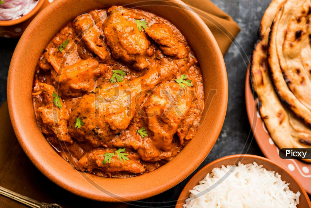 Delicious Butter Chicken Wallpaper: Creamy Dish with Rice & Naan