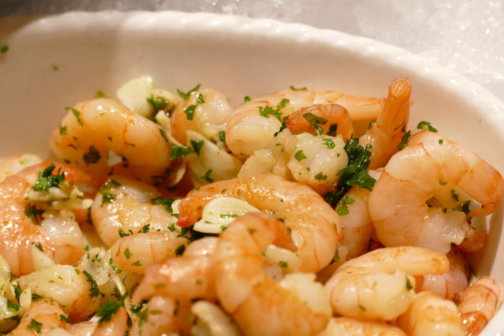 Delicious Buttered Scampi Shrimp Wallpaper with Fresh Herb Garnish