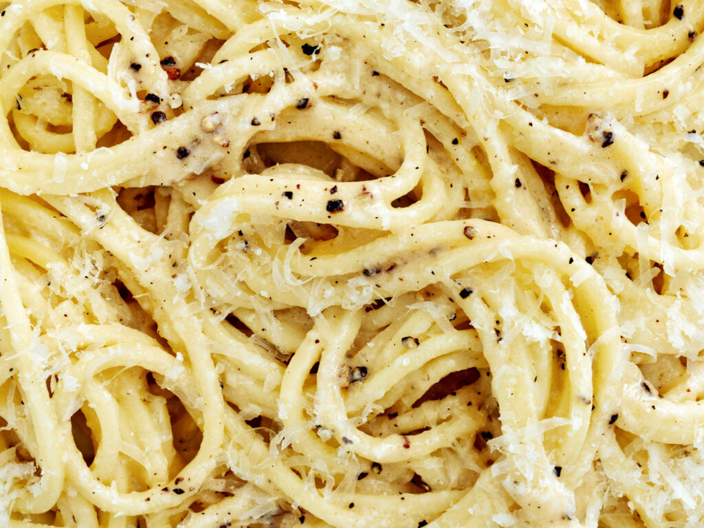 Rich Cacio e Pepe Pasta Close-Up: Creamy Texture & Cheese Wallpaper