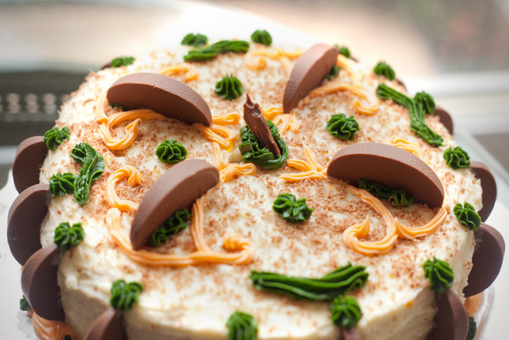 Delicious Cake Wallpaper: Cream, Chocolate & Green Frosting Design
