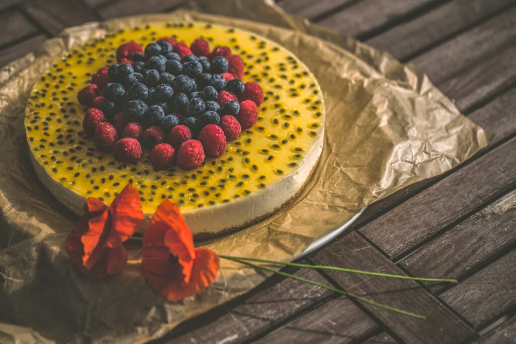 Beautifully Presented Cake with Raspberries & Passion Fruit Glaze Wallpaper