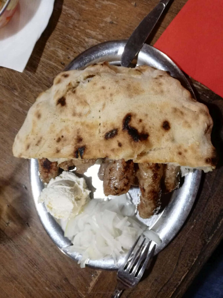 Delicious Ćevapi Sausages with Flatbread & Onions - Wallpaper Background