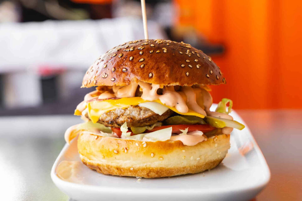Delicious Cheeseburger with Fresh Toppings - Wallpaper Background