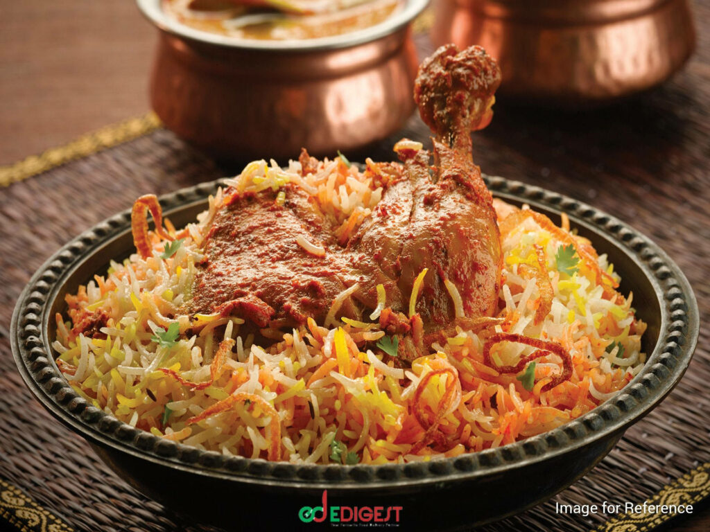 Delicious chicken drumstick biryani with aromatic rice and vibrant spices on rustic platter wallpaper