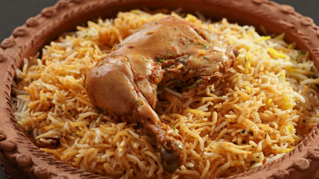 Illustration of flavorful chicken biryani with spiced rice served in traditional clay pot wallpaper