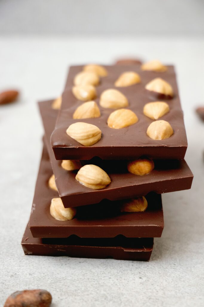 Delicious Wallpaper: Chocolate Bars with Hazelnuts | Sweet Crunch Background