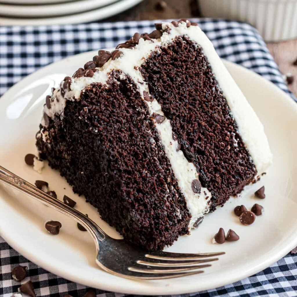 Decadent Chocolate Cake Slice with Creamy Filling - Wallpaper Background