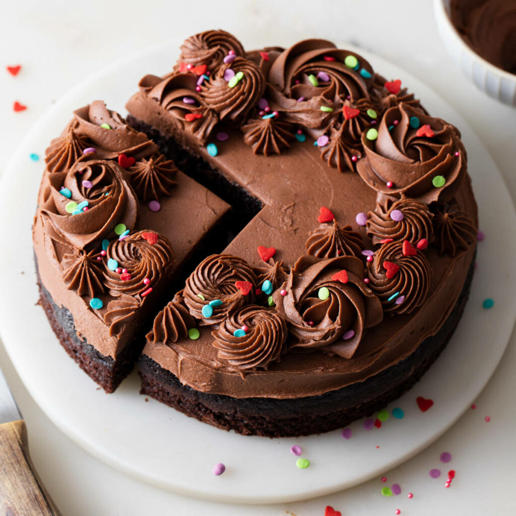 Delicious Chocolate Cake Wallpaper: Icing & Colorful Sprinkles Delight