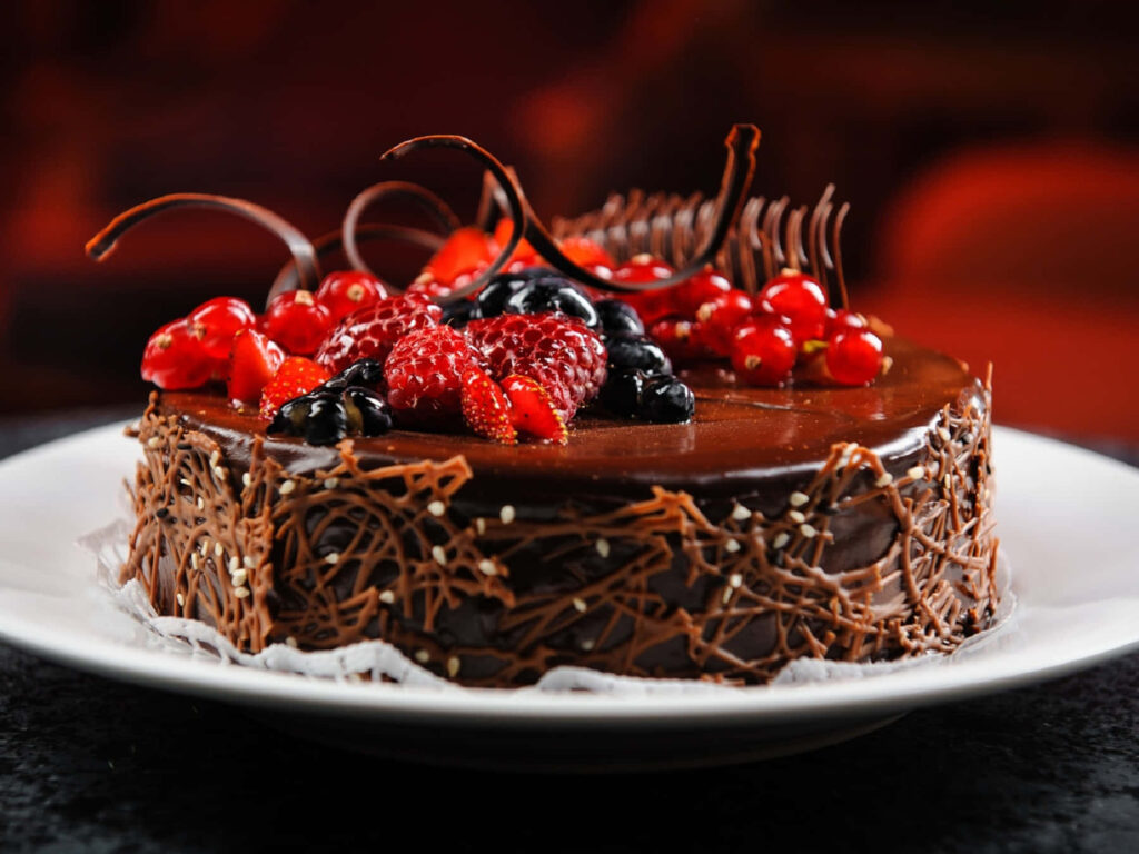 Delicious Chocolate Cake with Fruits & Swirls - Wallpaper Background