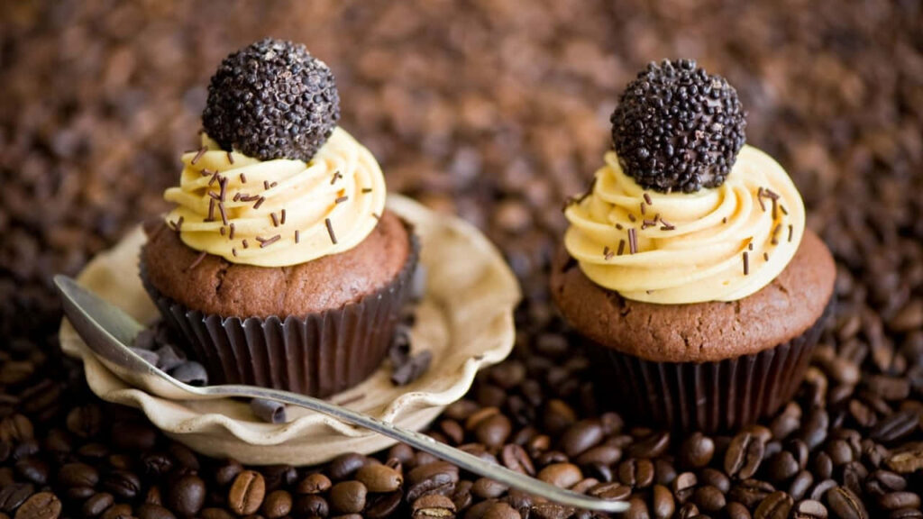 Indulgent Chocolate Cupcake Wallpaper with Coffee Bean Background