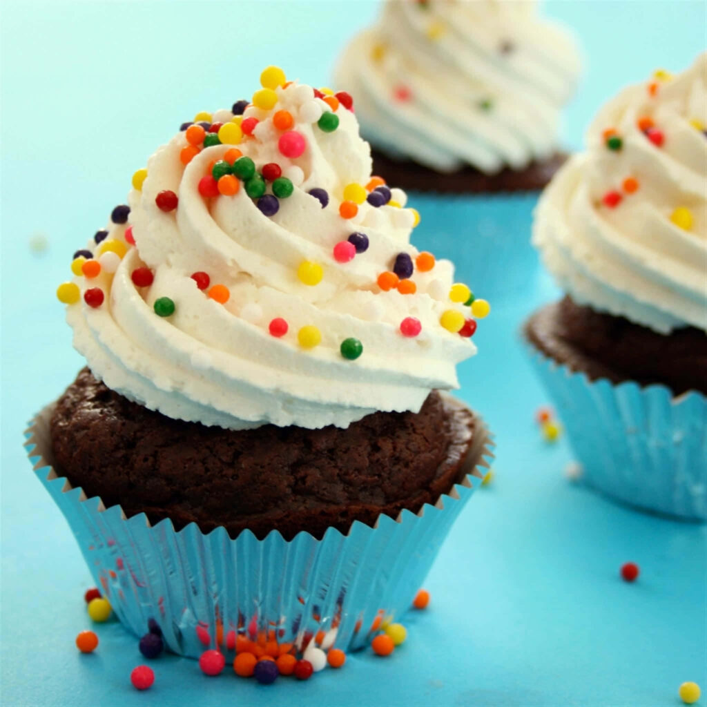 Delicious Chocolate Cupcake Wallpaper: Whipped Cream & Sprinkles
