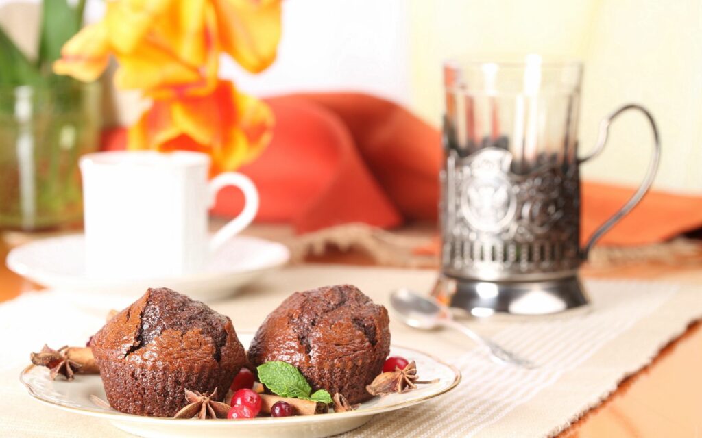 Delicious Chocolate Cupcakes with Tea: Inviting Wallpaper Background