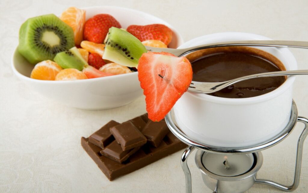Indulgent Chocolate Fondue with Fresh Fruits Wallpaper Background