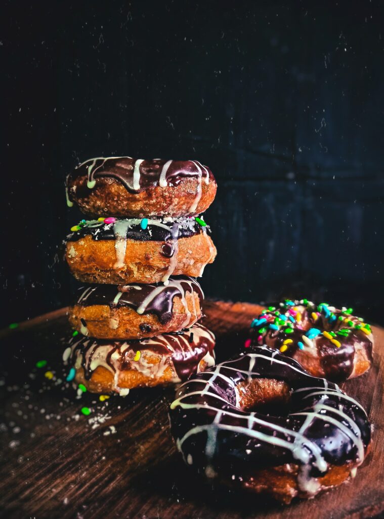 Colorful Chocolate-Glazed Donuts Wallpaper for Dessert Lovers