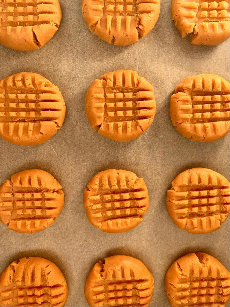 Delicious Homemade Orange Cookies on Parchment: Perfect for iPhone Wallpapers!