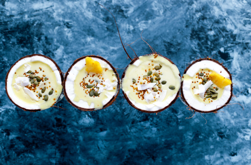 Vibrant Coconut Ice Cream Wallpaper: Tasty Treats on Blue Background