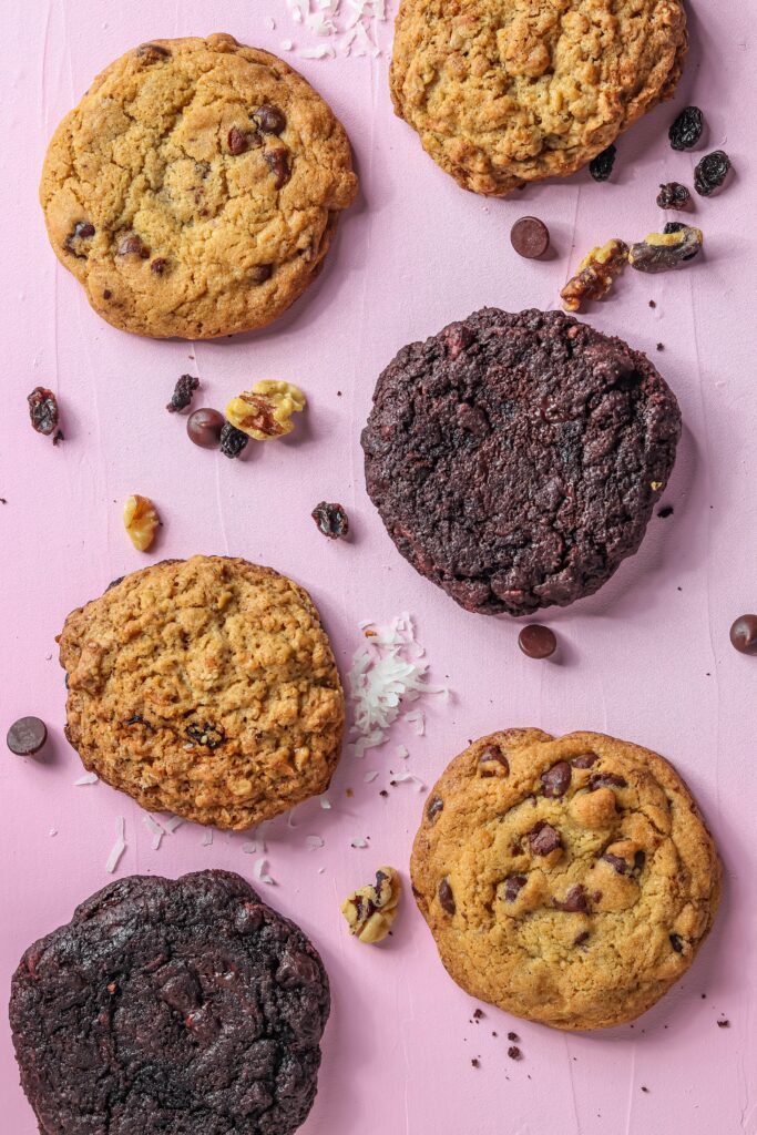 Delicious Cookies Wallpaper: Chocolate Chip & More on Pink Background