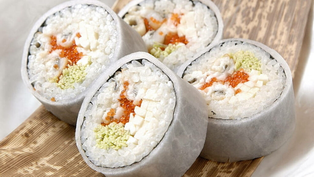Delicious Crab Roe Rice Rolls on Wooden Platter - Fresh Ingredients! Wallpaper