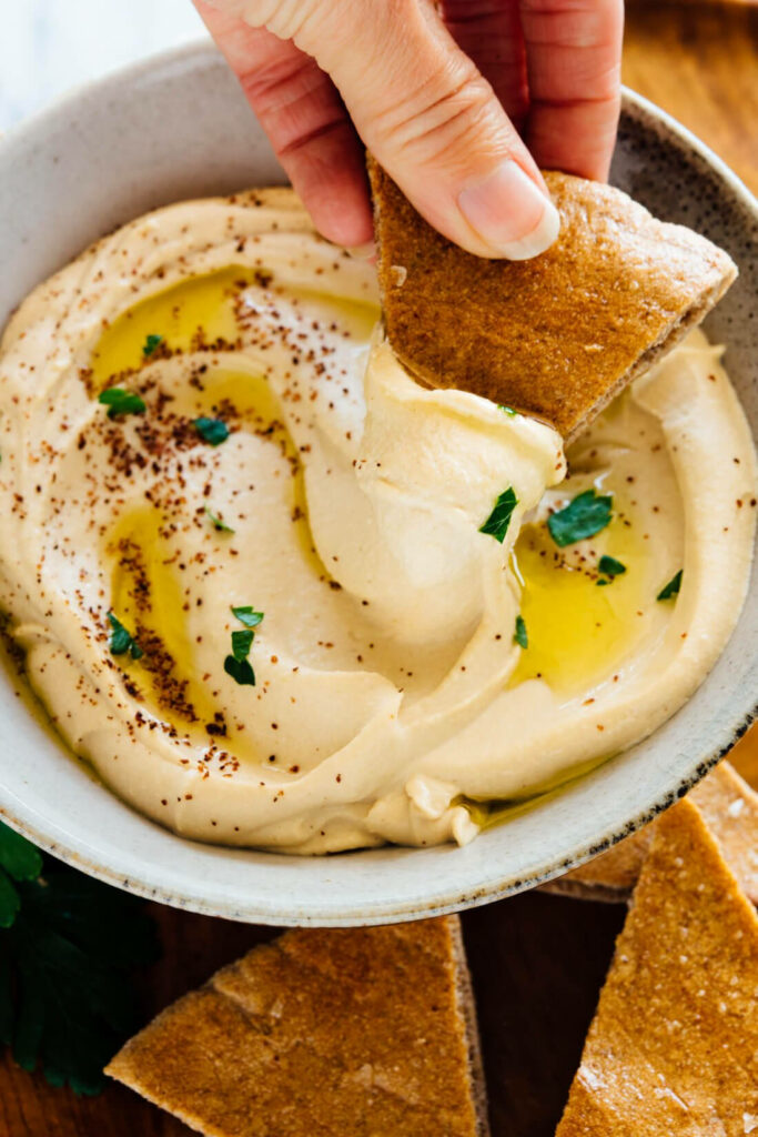 Appetizing Hummus Dip Close-Up with Pita Bread - Wallpaper Background