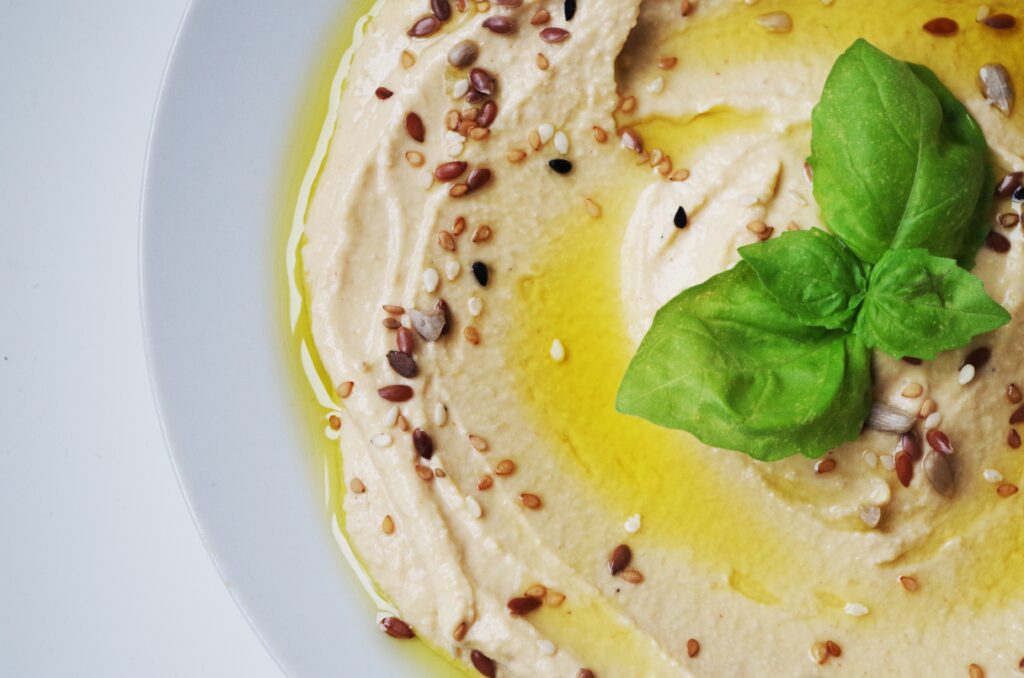 Creamy Hummus with Olive Oil & Basil - Elegant Wallpaper Background
