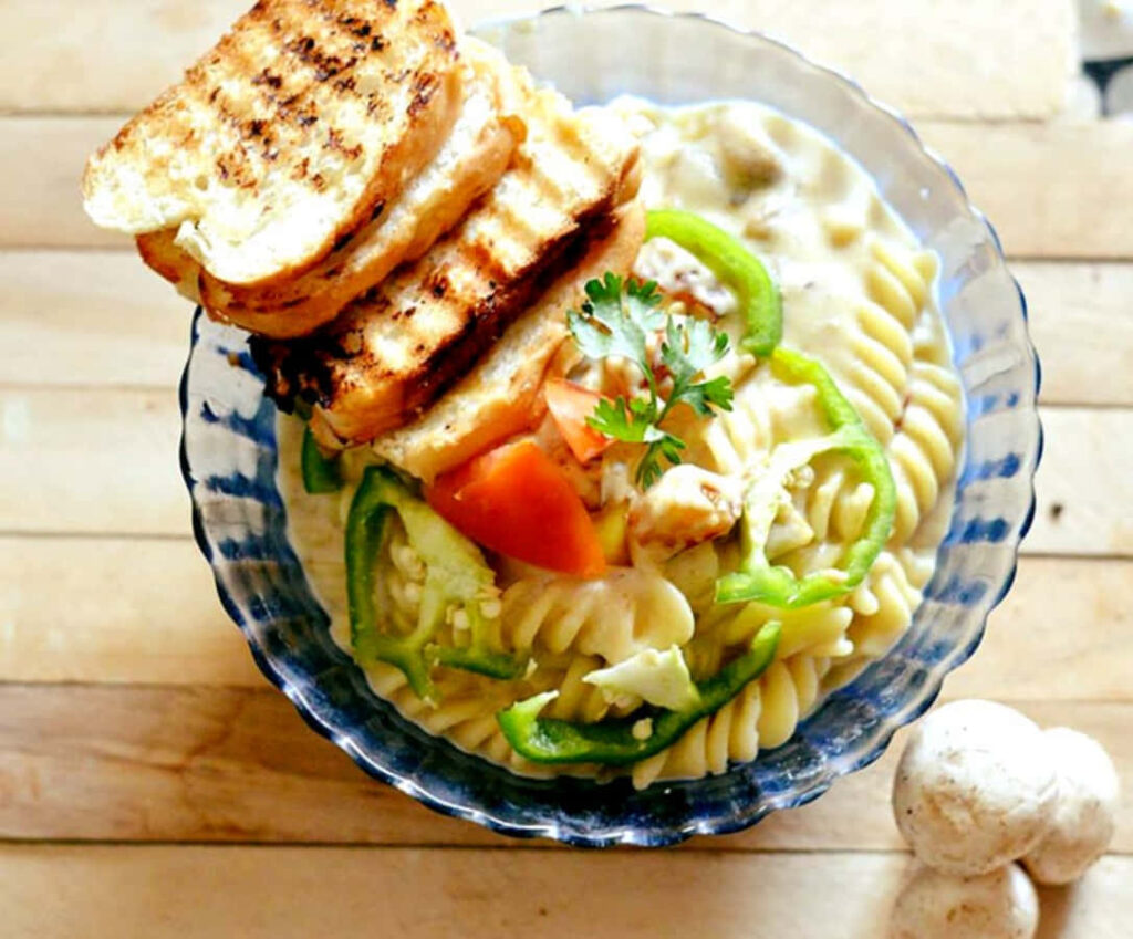 Delicious Creamy Pasta with Fresh Veggies - Tasty Wallpaper Background