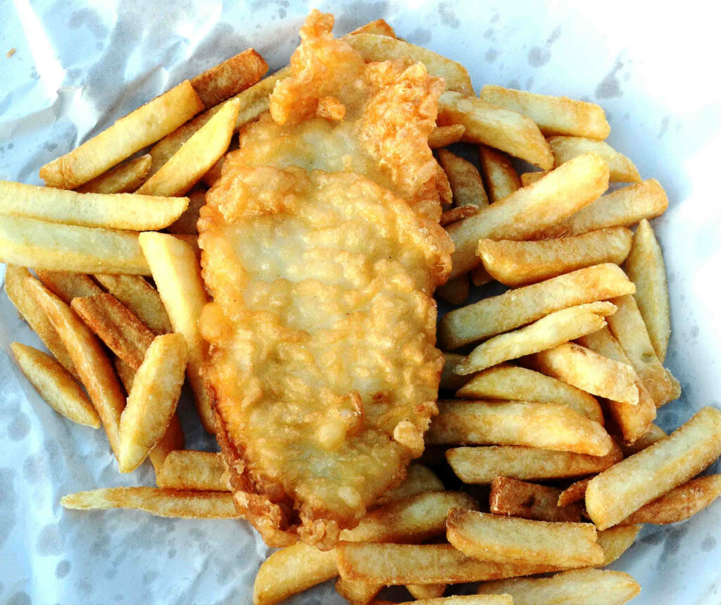 Delicious Fried Fish Fillet & Chips on Parchment - Wallpaper Image