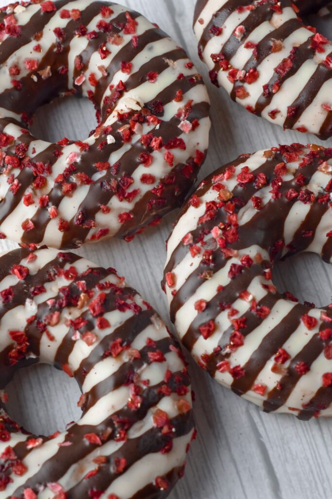 Delicious Donut Wallpaper: White & Chocolate Stripes with Berries