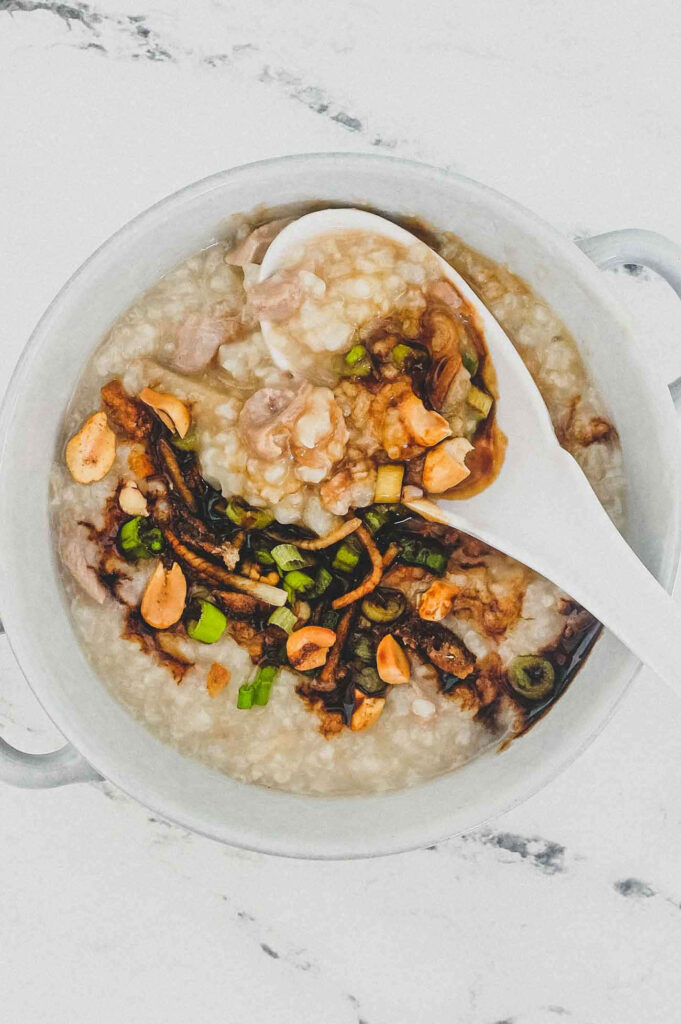 Cozy Duck Rice Congee with Green Onions & Crispy Garlic Wallpaper