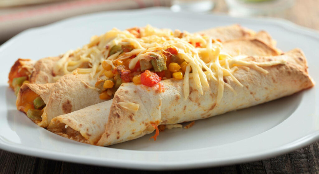 Delicious Enchiladas with Cheese, Corn, Peas & Tomatoes - Wallpaper